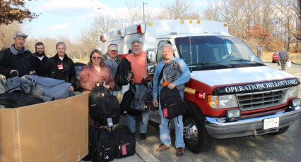 BASF Employee Veterans Team members present backpacks for 2014-15 winter homeless veterans outreach campaign