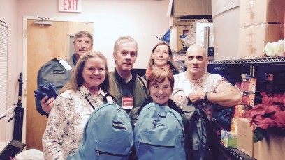 Paterson – Eva’s Village and Shelter staff receive women’s backpacks and winter supplies from CHILLOUT delivery team.