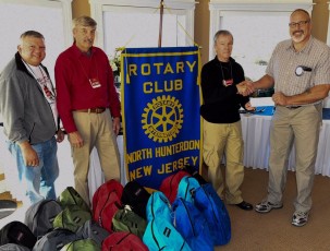 CLINTON ROTARY CLUB SUPPORTS WINTER HOMELESS OUTREACH Tony, Ken, Ray and President Jim Murray at annual Clinton Rotary Club backpack drive meeting.