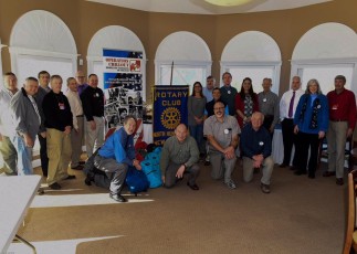 CLINTON ROTARY CLUB SUPPORTS WINTER HOMELESS OUTREACH Club members prep a full case of backpacks for homeless veterans 2016-2017 winter outreach.