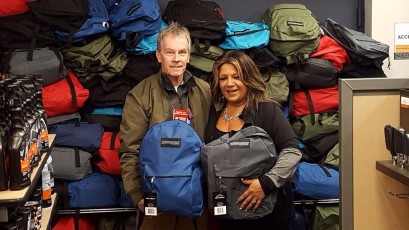 Renee manager of Long Branch Harley Davidson presents 115 filled backpacks collected by Shoreline and Ocean County Harley Davidson riders to Deacon Ray for the 2016 annual winter homeless veterans outreach campaign. Thank you Ocean and Monmouth county riders - you're the best!