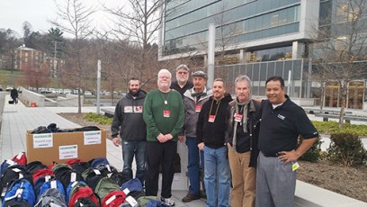 BASF Veterans Employee Team presents supplies and backpacks for 2015 winter homeless veterans outreach.  L to R Tom Wicklow, OCO Logistics; John Hennessey, OCO Location Coordinator; Stephen Serna, BASF; Ken Steffan, OCO Logistics; Joe Iozzia, OCO Treasurer; Ray Chimileski, OCO Executive Director; Pablo Lizarazo, BASF VET Employee Team Coordinator.