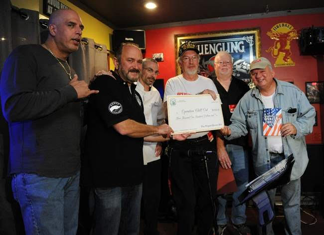  Steven Bongioranni, Rick DeFino, owner of the Original Pocono Pub in Bartonsville, Chef Jim DeSantis, all left, present a check to Operation Chillout members Al Compoly, PA-Outpost Homeless Veterans Coordinator; John Hennessy, Morris County Location Coordinator; and MAJ Tony DeStefano, USAR, RET, National Homeless Veterans Outreach Coordinator all right, from the Pocono Pub Wednesday night. The money will aid Operation Chillout in their mission to help homeless veterans by providing rapid response to critical needs of area homeless veterans. 