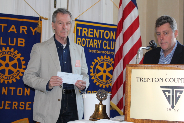  Greg Gourovitch, President of Trenton Rotary Club presents a generous donation to Ray Chimileski to support Operation Chillout's homeless veterans outreach projects.