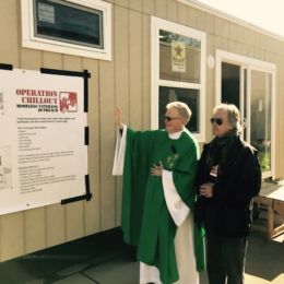 Fr Mike Drury blesses our first homeless vets tiny home over veterans day weekend at St Luke Church open house tour in Long Valley